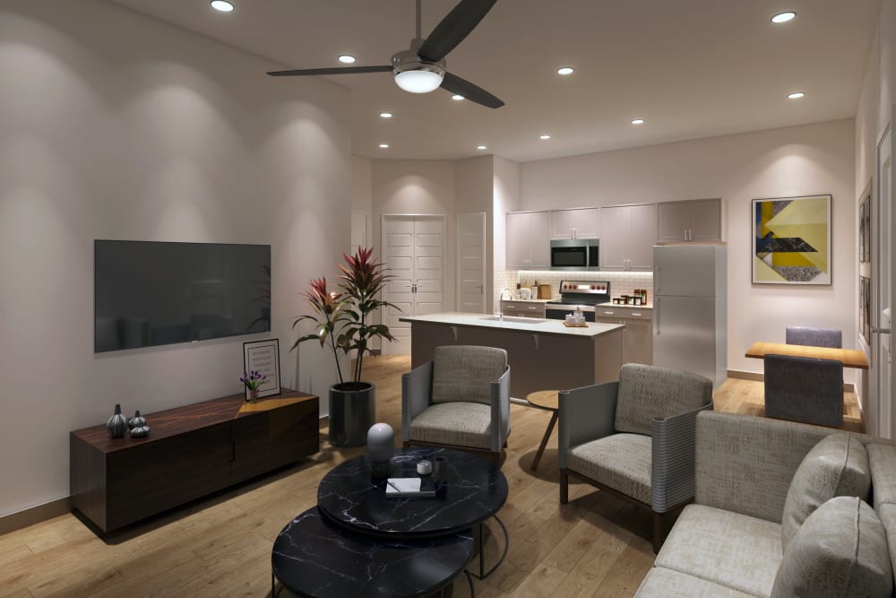 Open living room and kitchen layout in an apartment at The Waters at Redstone in Crestview, Florida