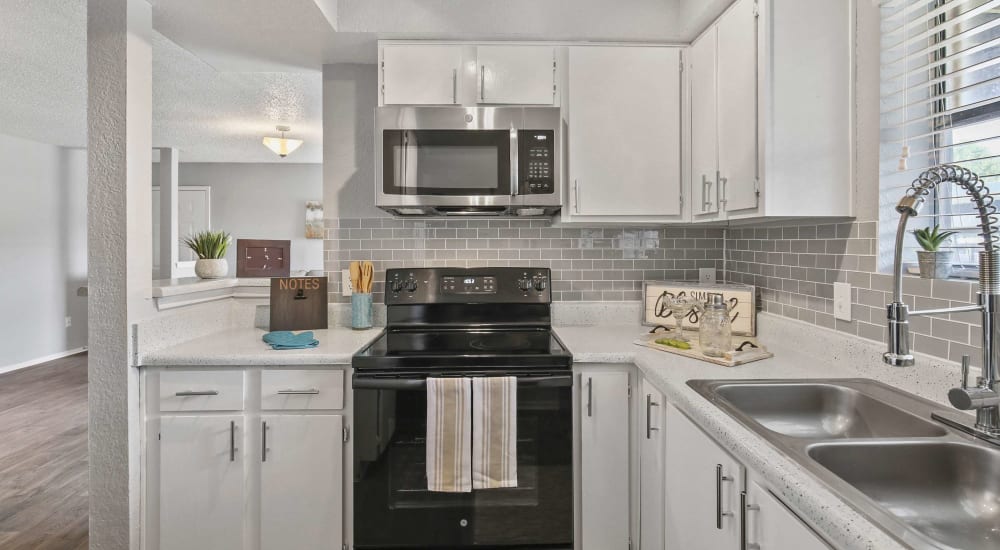 Modern kitchen in a new apartment at The Hub at Chisolm Trail in Fort Worth, Texas