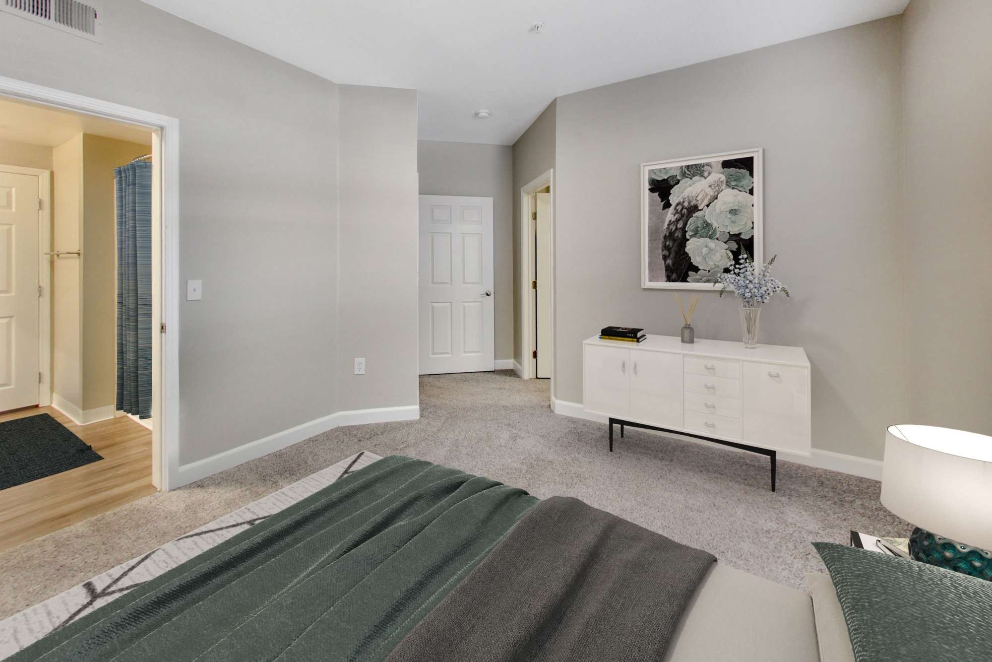 Spacious bedroom with plush carpet flooring at Avion Apartments in Rancho Cordova, California