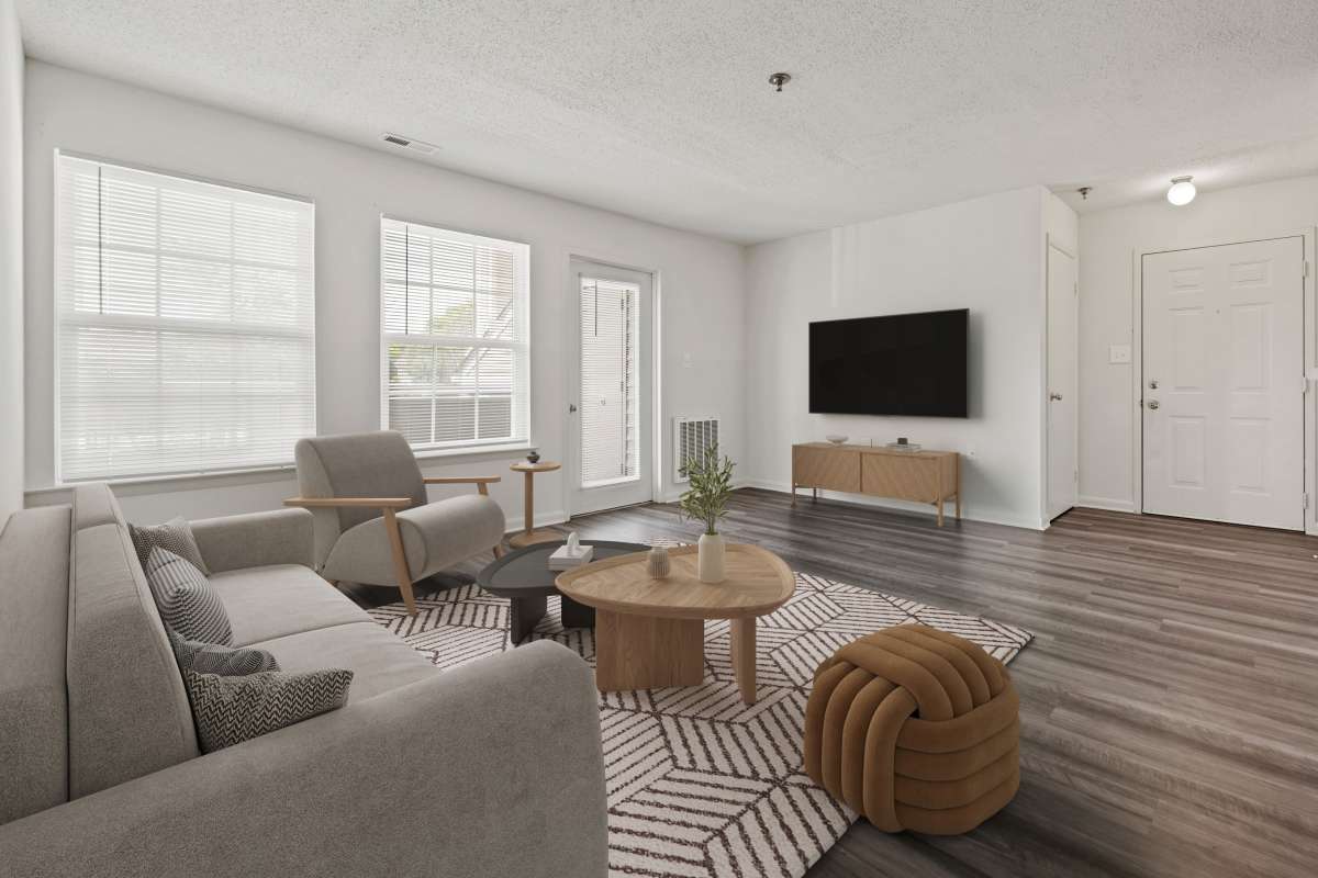 Spacious living area with wood-style flooring at Parkside Landing Apartments in Rockville, Maryland
