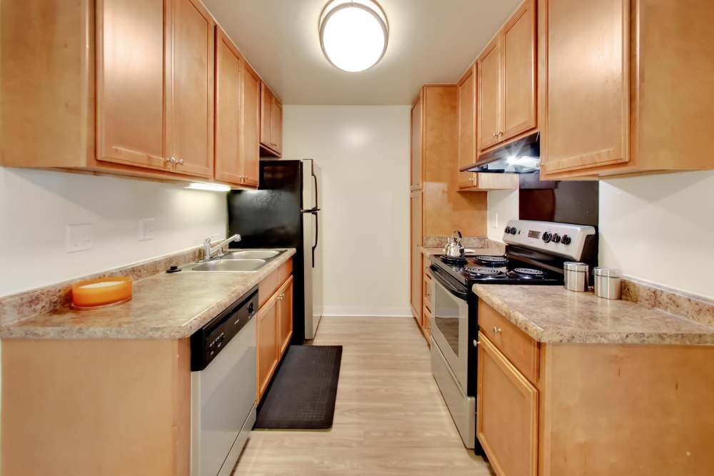 Kitchen with wooden cabinets at Lakeside Village in San Leandro, California