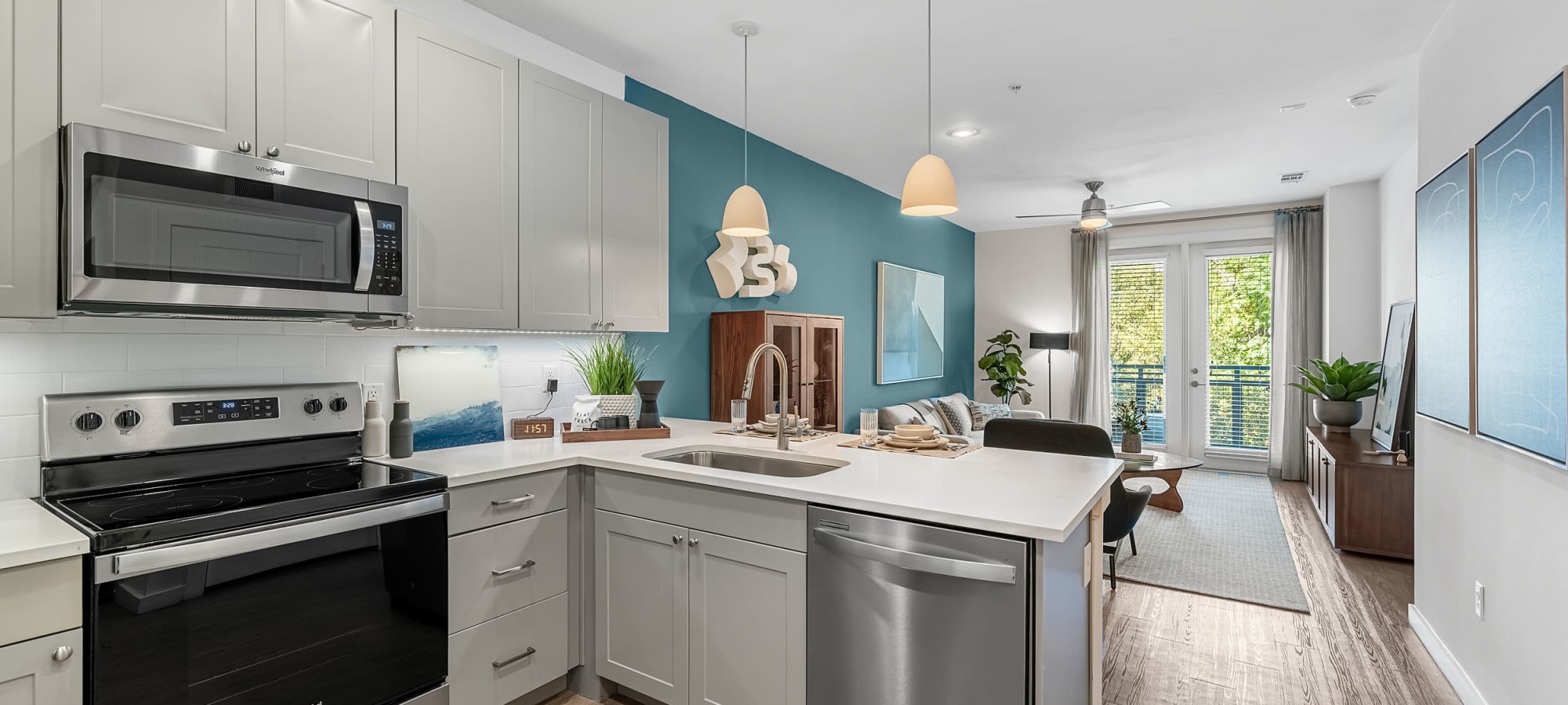 Modern kitchen with wood style flooring at 44 South in Austin, Texas