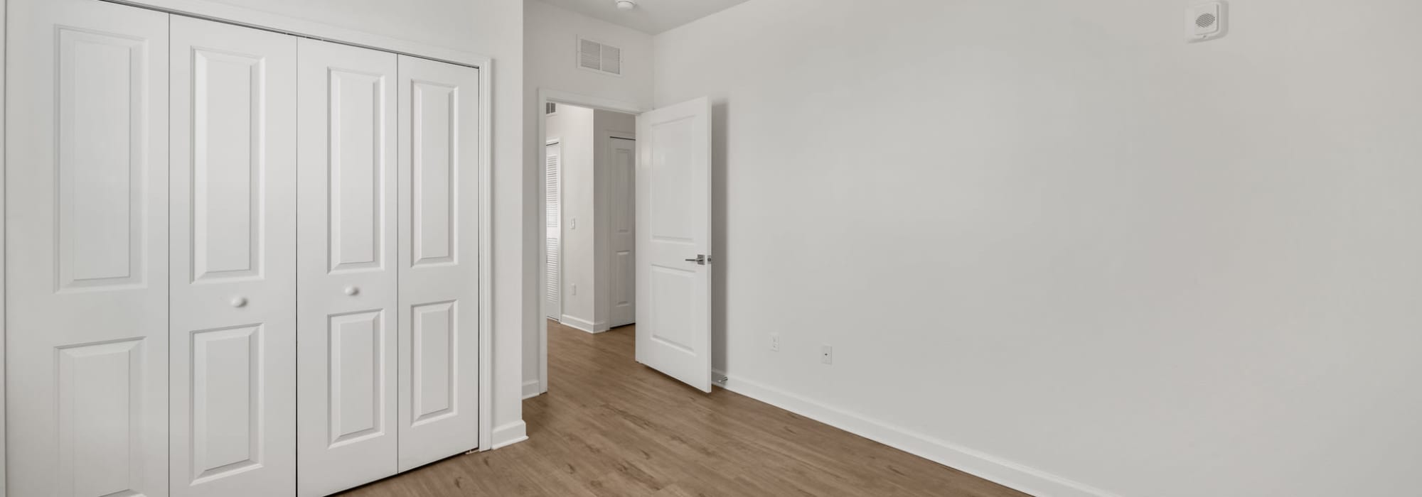 Bedroom with in-unit laundry at Fletcher Black in Panama City, Florida