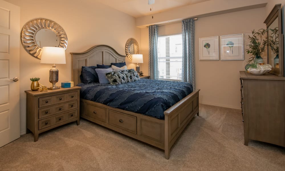 Spacious bedroom with plush carpeting at Redbud Ranch Apartments in Broken Arrow, Oklahoma