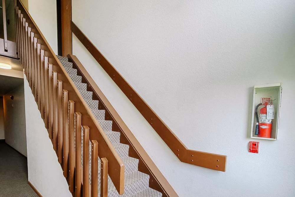 Stairs to upper floor at Rivercrest Apartments in Croswell, Michigan