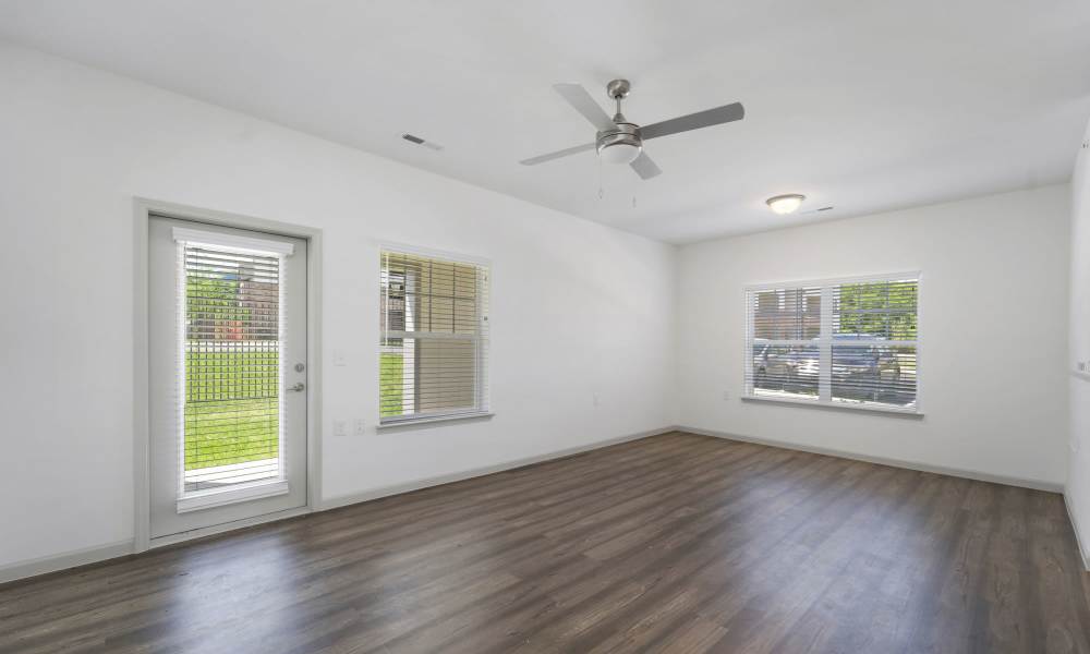 Unfurnished living room with wood-style flooring at The Warrick in Nashville, Tennessee