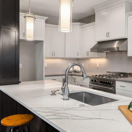 Open-concept, stainless steel appliance kitchen at Pacific Palms in Stockton, California