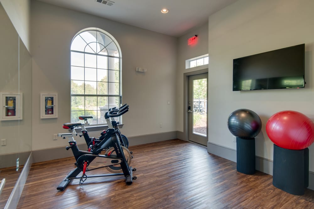 Gym with spin bike and exercise balls at Legacy at Meridian in Durham, North Carolina