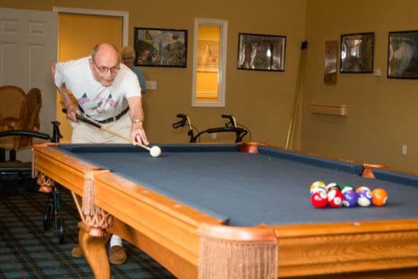 A resident playing pool at Governor's Port in Mentor, Ohio