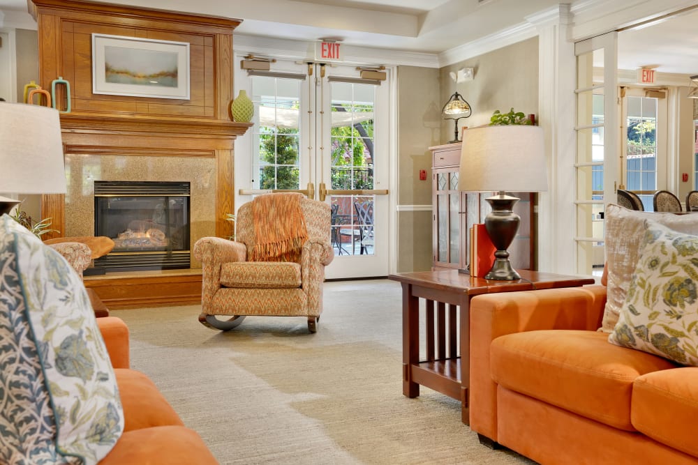 Community seating area with furnishings and fireplace at Kirkwood Orange in Orange, California