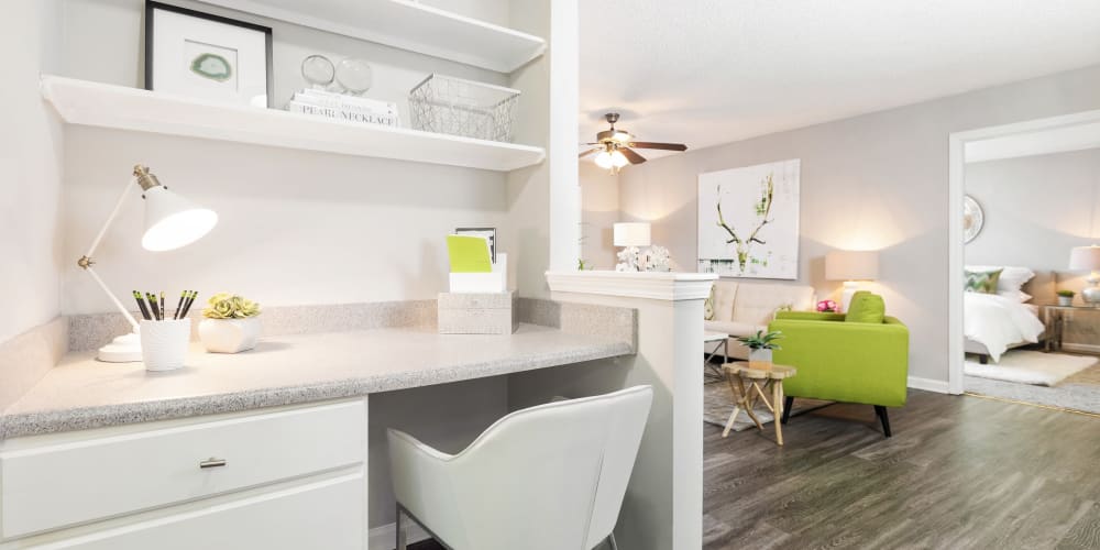 Office nook next to the living area in modern home at Belle Vista Apartment Homes in Lithonia, Georgia