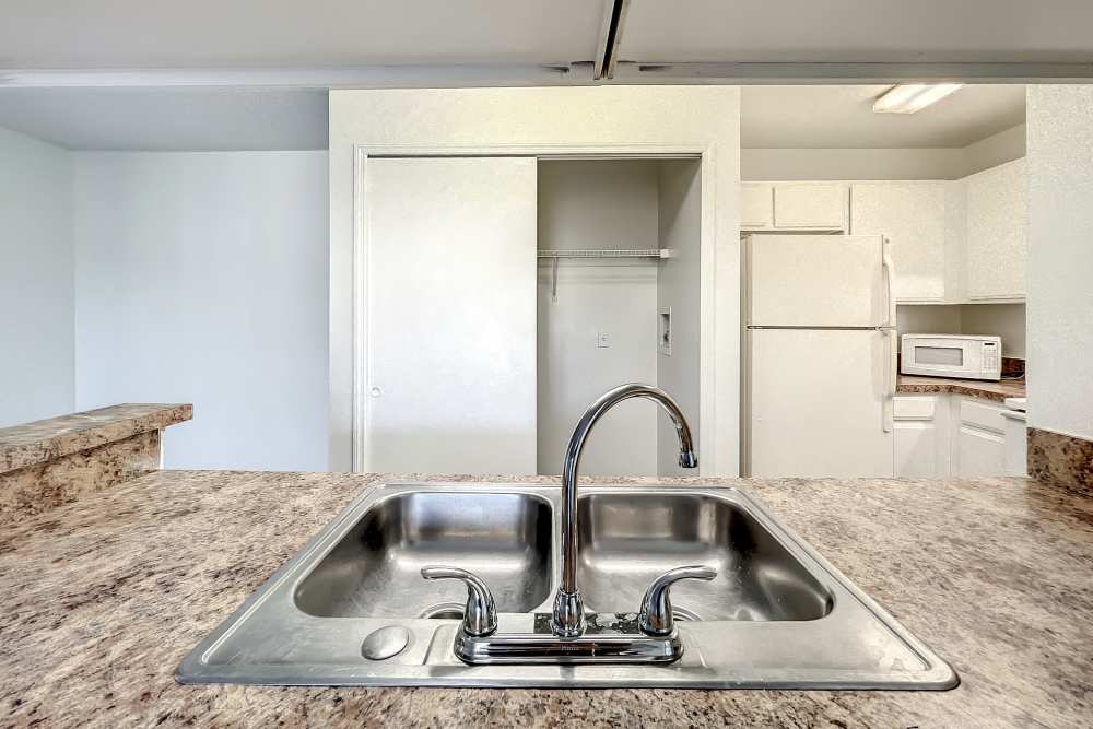 Stainless steel sink of an apartment at Huntington Reserve in Sanford, Florida