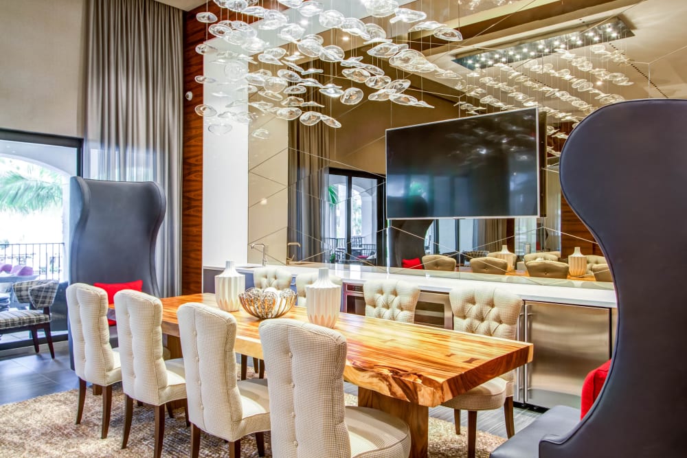 Long dining table in the resident lounge at Luzano in Pompano Beach, Florida