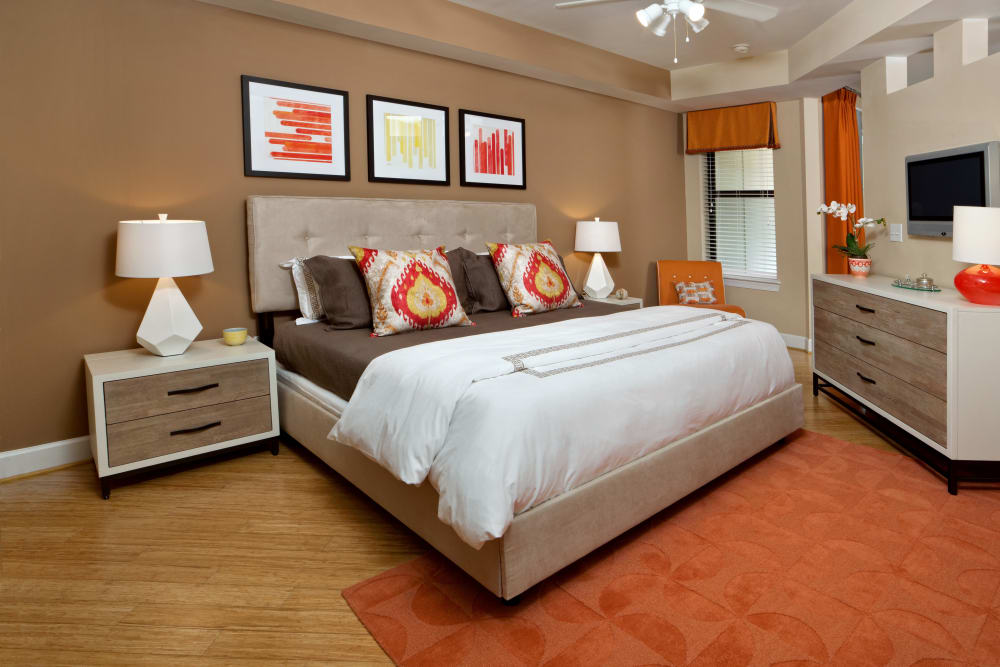 Model bedroom with hardwood floors and ceiling fan at Cielo in Charlotte, North Carolina