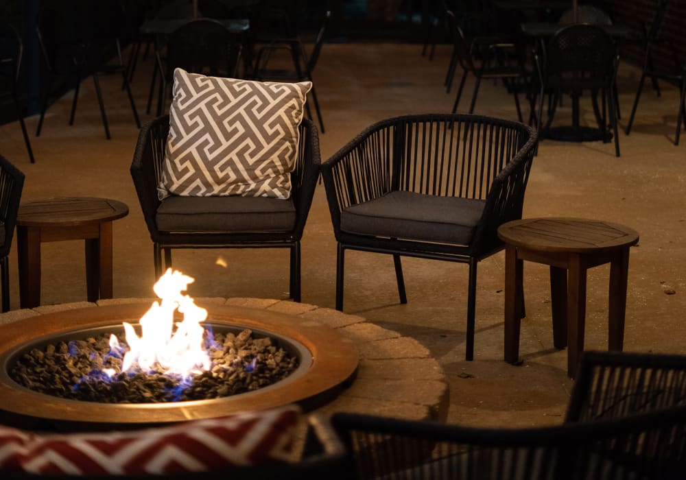 Outdoor fireplace with plenty of seating at LARC at Burien in Burien, Washington