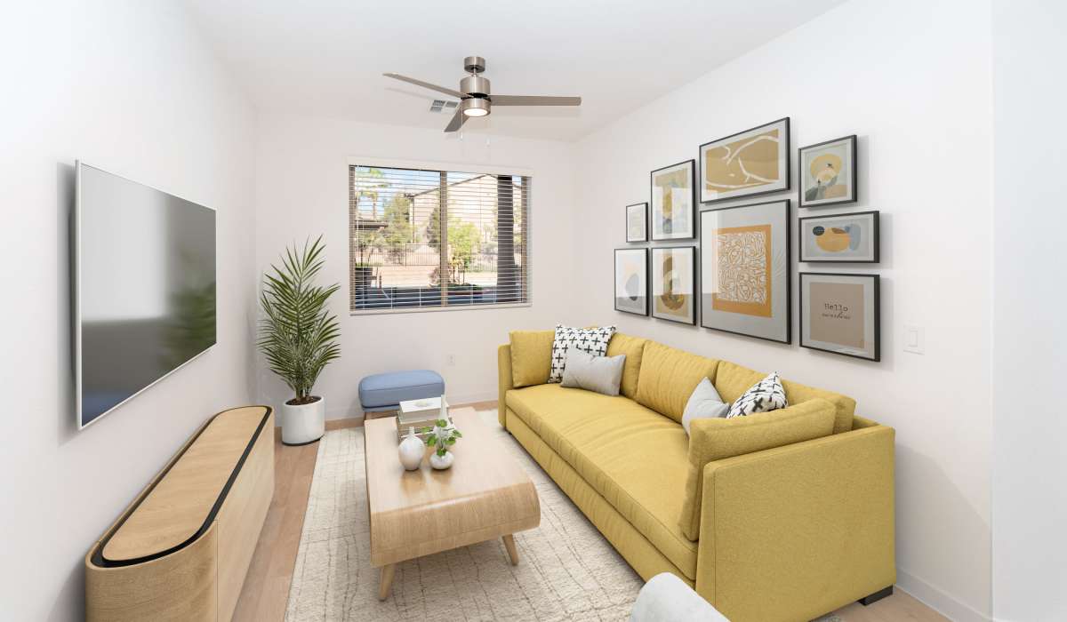 Living room with beautiful wall art  at Heirloom at Pebble in Las Vegas, Nevada