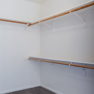 A walk-in closet with storage shelves in a home at Wire Mountain II in Oceanside, California