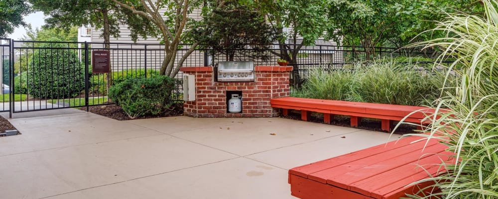 An outdoor grilling station with seating at Windsor Park in Woodbridge, Virginia