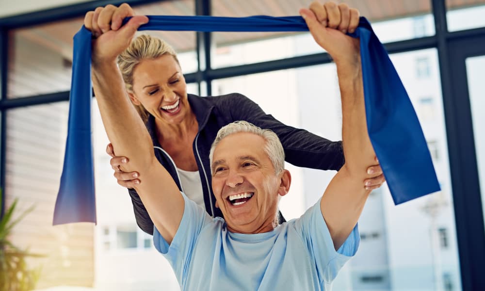 Resident and staff member at Americare Senior Living