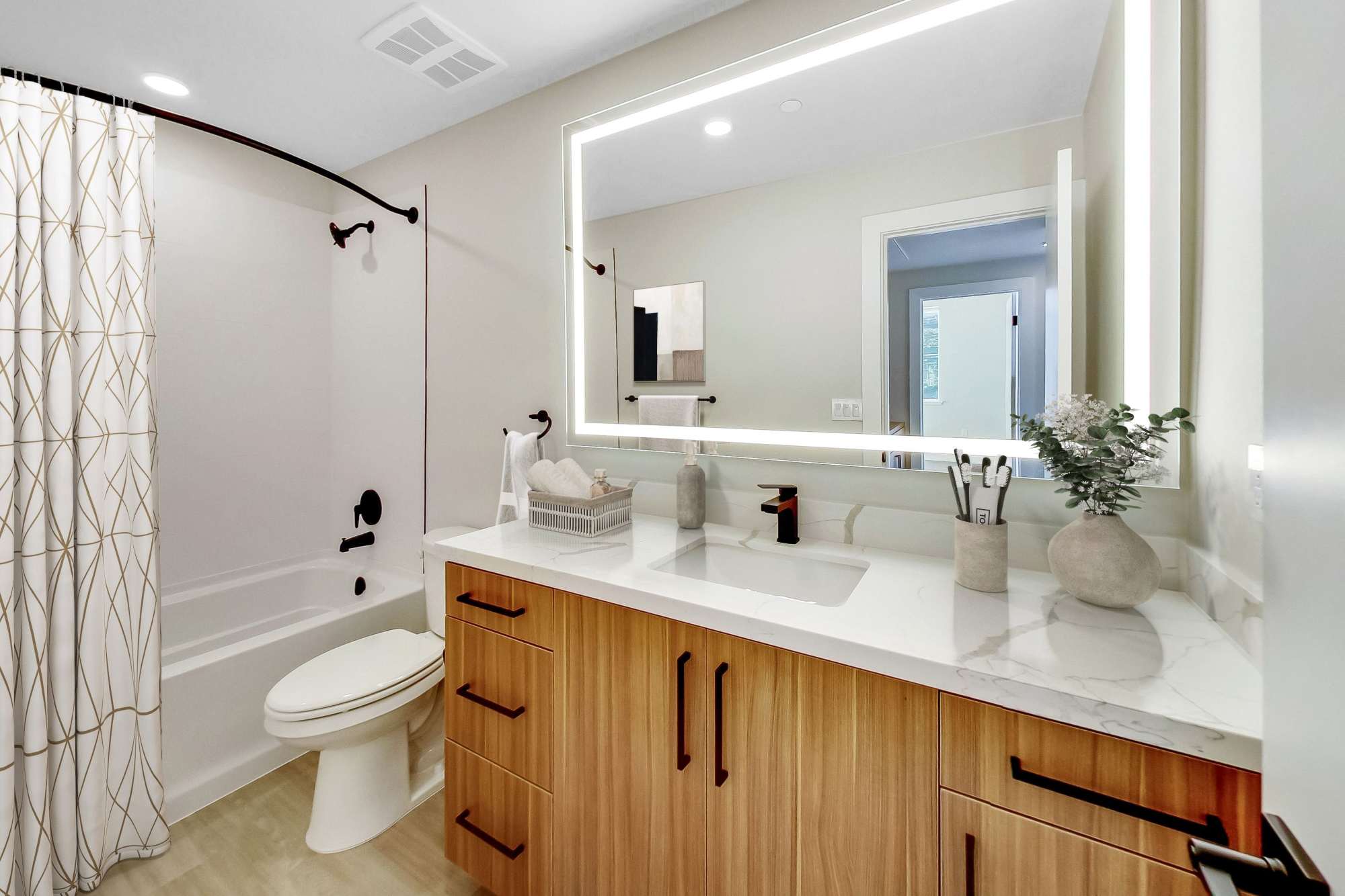 Large Bathroom with Shower Tub and Backlit Mirror at Domaine at Napa Junction in American Canyon, California