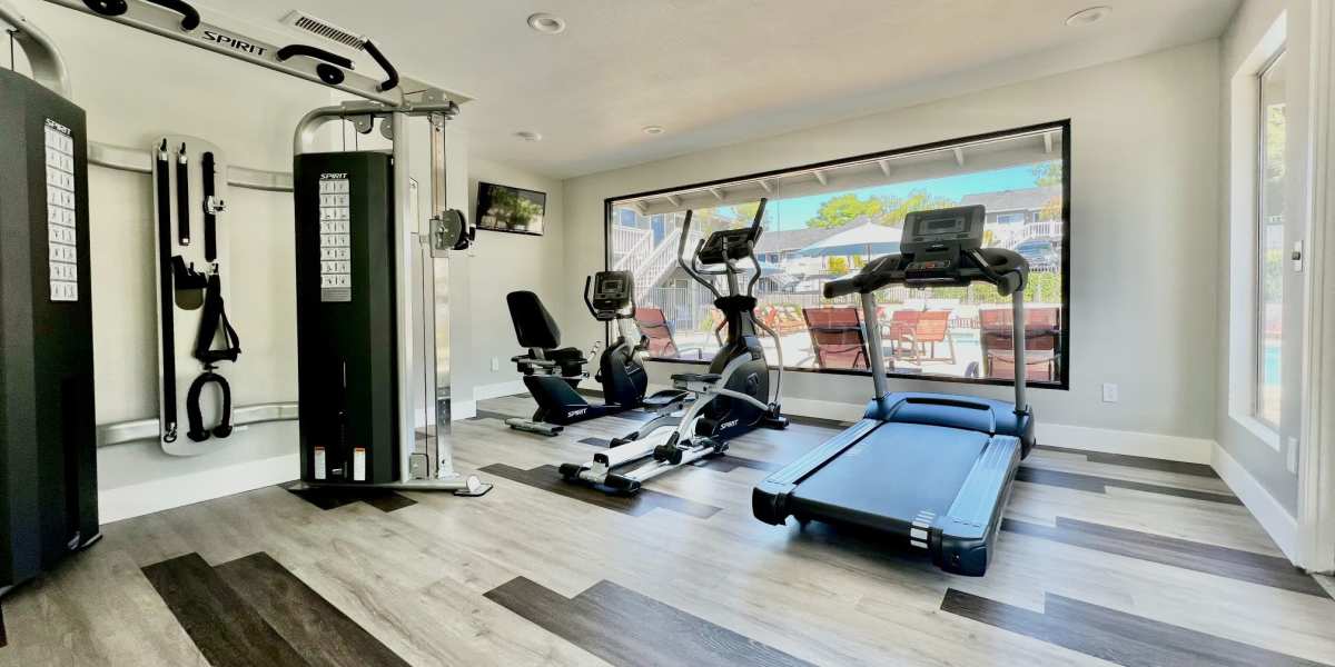 Fitness center with plenty of individual workout stations at Hillside Terrace Apartments in Lemon Grove, California