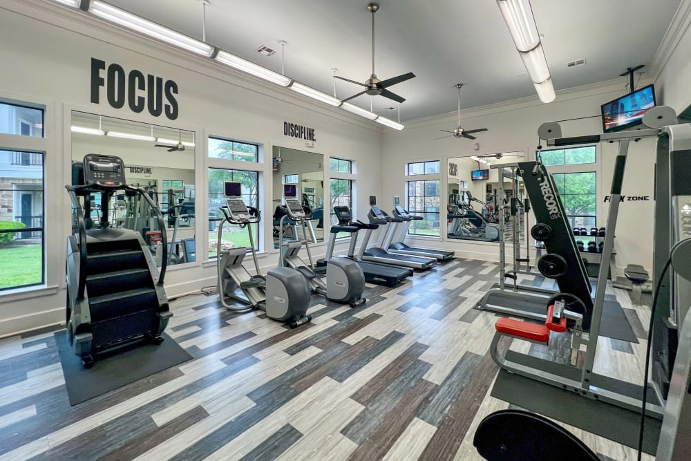 Fitness center with plenty of individual workout stations at Broadstone Grand Avenue in Pflugerville, Texas