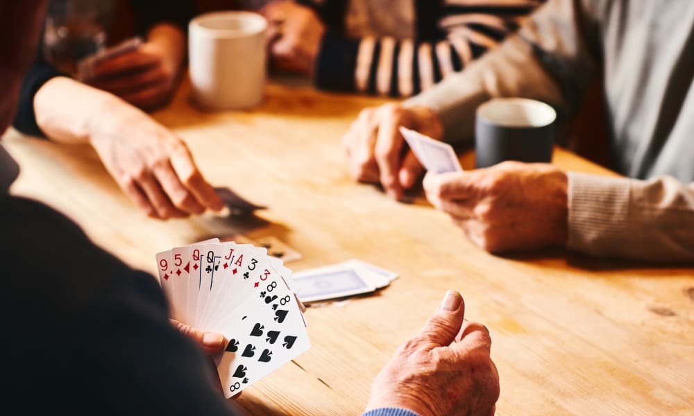 Residents playing cards at Carnegie Heights at Henderson in Henderson, Nevada