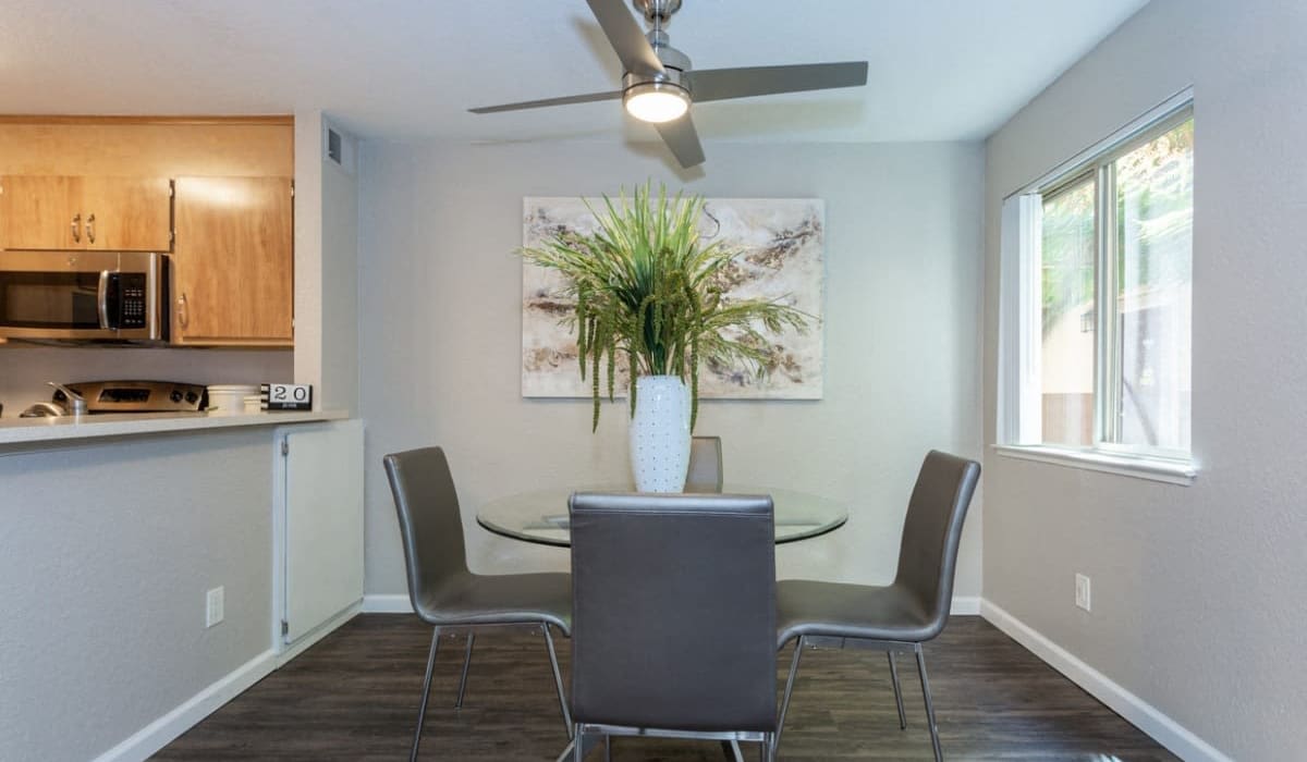 Dining area with ceiling fan at  The Reva in Citrus Heights, California