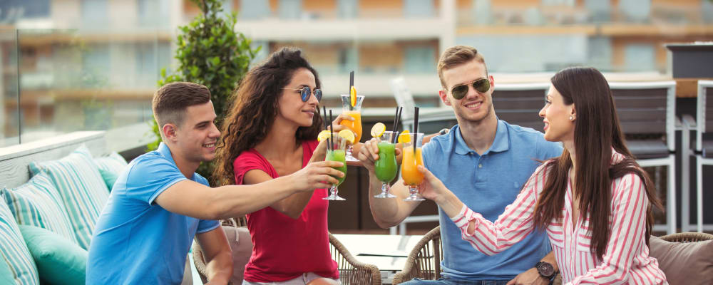 Residents raising a toast to the good life at Olympus Property Management in Fort Worth, Texas