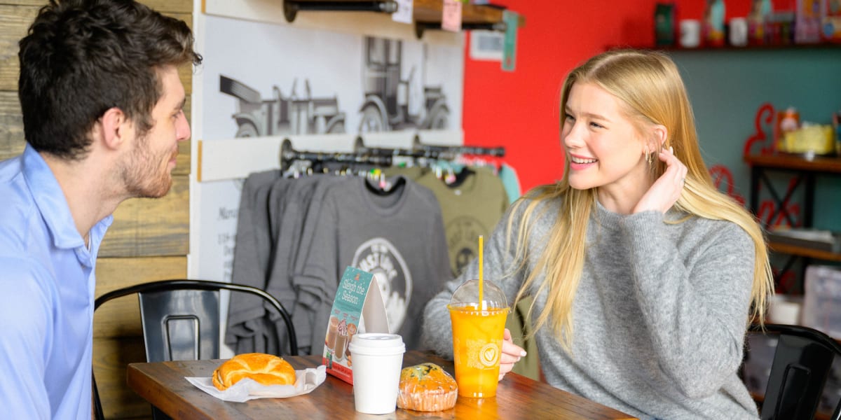 Friends having coffee and pastries near The Scottie in Nashville, Tennessee