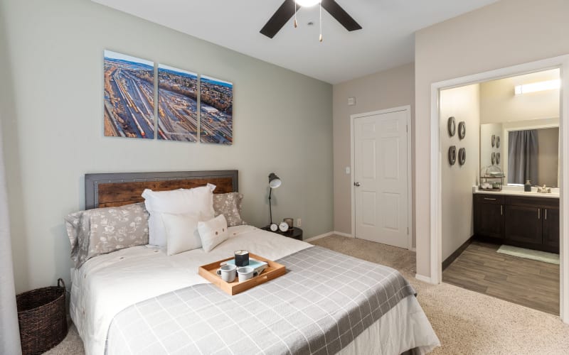 Spacious master bedroom with plush carpeting at HighGrove Apartments in Everett, Washington