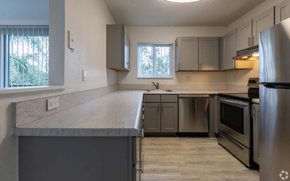 Kitchen with stainless-steel appliances at Sunset Bay Apartments in Cutler Bay, Florida