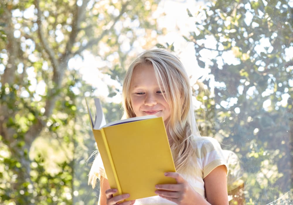 Child reading a book at Sofi Poway in Poway, California