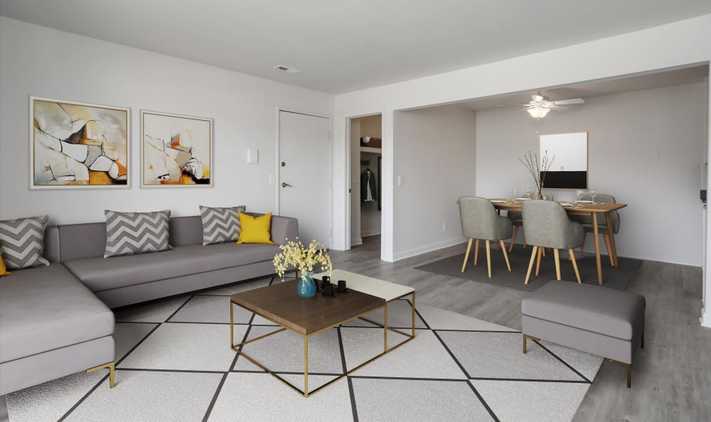 Modern and stylish living room at The Trilogy Apartments in Belleville