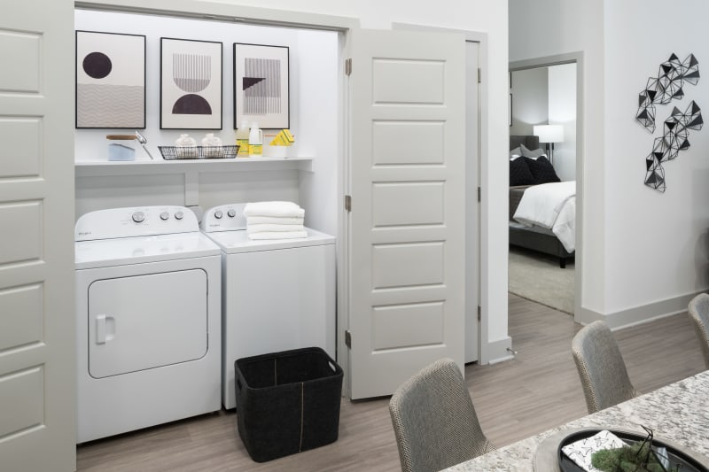 In unit washer and dryer with storage at The ReVe in Garland, Texas