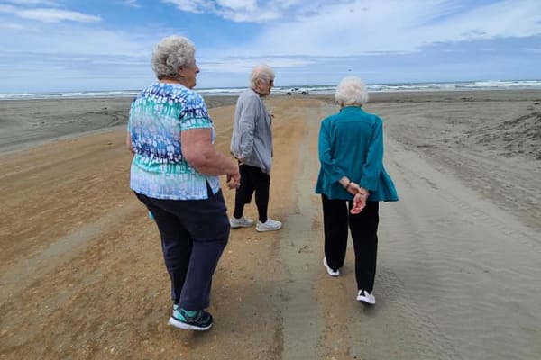 Seniors walking down a trail near The Lakes at Banning