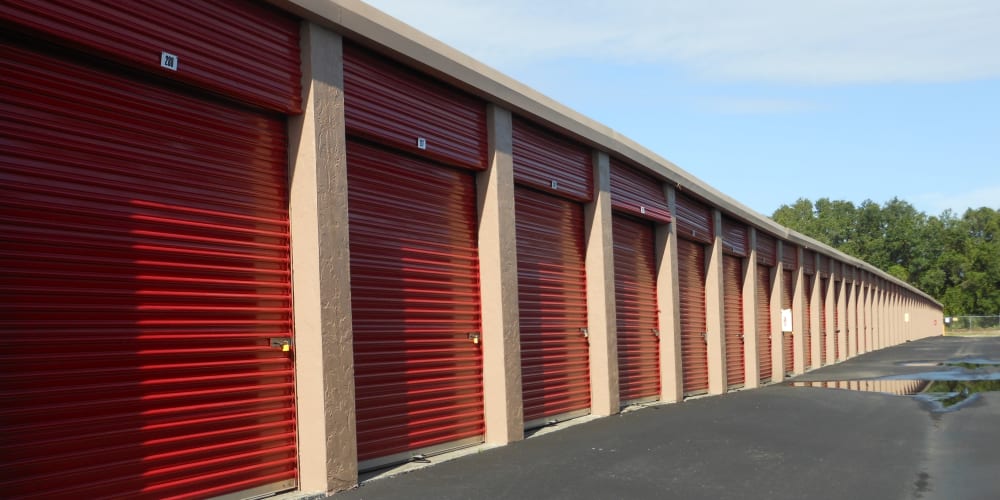 Outdoor storage units with red doors at StorQuest Self Storage in Sarasota, Florida