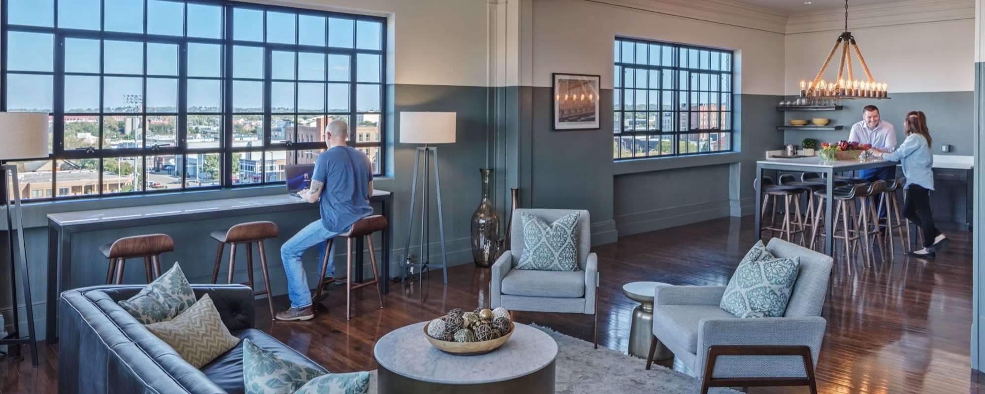 Modern lounge area with city views at Delco Lofts in Dayton, Ohio