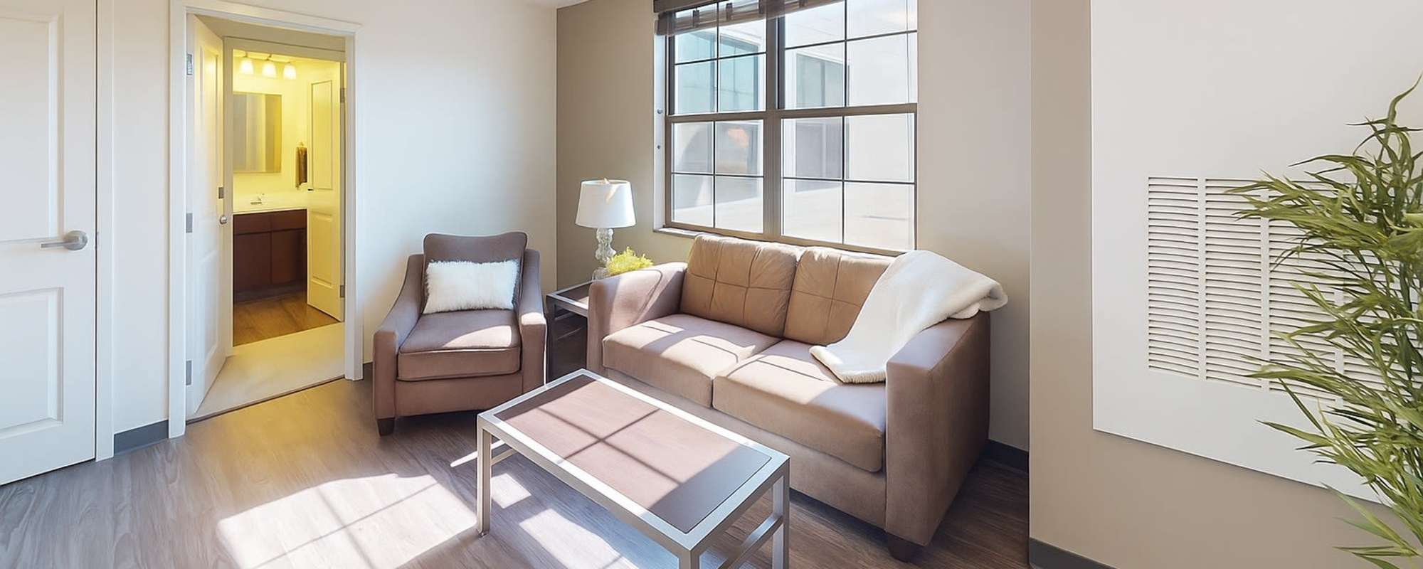 Living room with large size window at Hudson Lofts in Erie, Pennsylvania