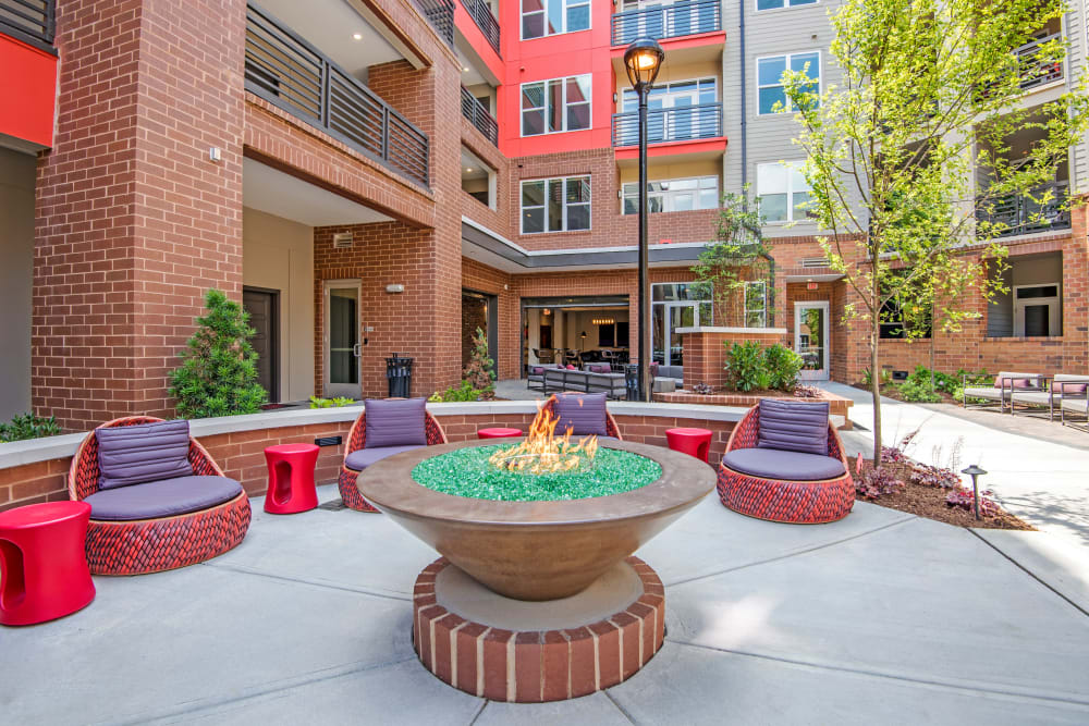 Fire pit and grilling lounge at Mercury NoDa in Charlotte, North Carolina