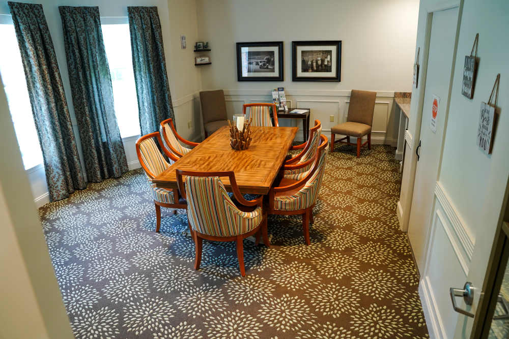 Community room with large table at Harmony on the Peninsula in Yorktown, Virginia