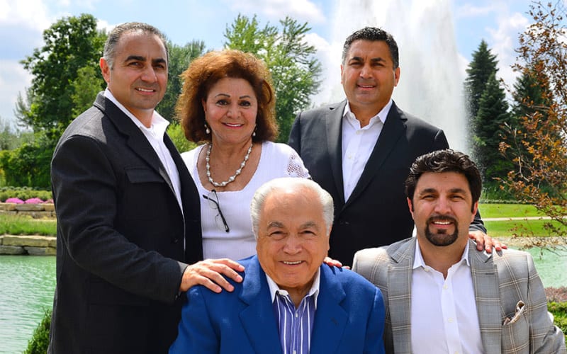 Outdoor group photo of Frank Moceri, Frances Moceri, Dominic Moceri, Dominic J. Moceri, and Mario Moceri