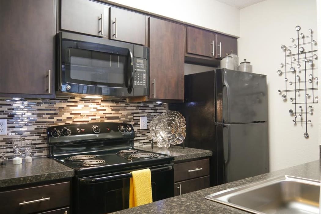 Kitchen with designer cabinetry at Trails of Towne Lake in Irving, Texas