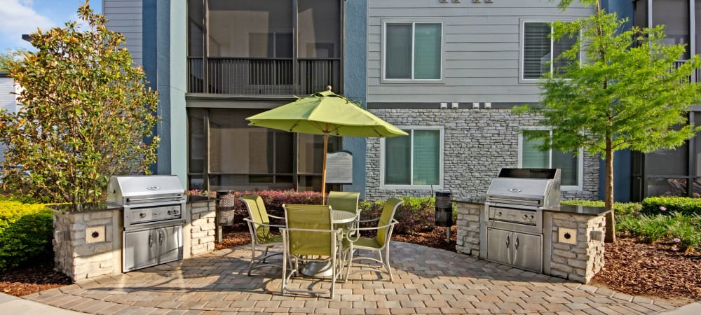 The Courtney at Lake Shadow offers a community BBQ grill in Orlando, Florida