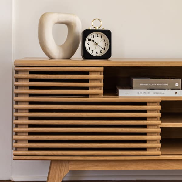 Stylish table with clock at Braden Fellman Group in Atlanta, Georgia