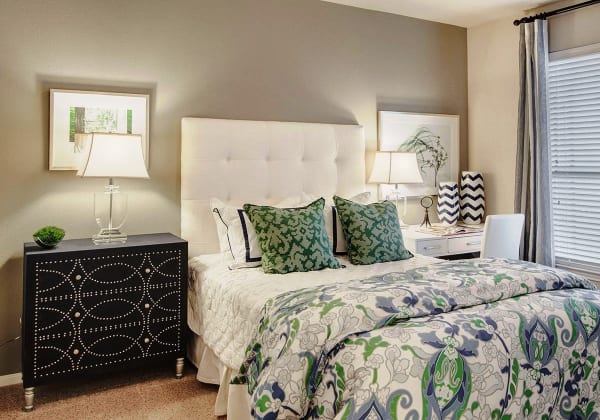 Naturally well-lit bedroom at Ridgecrest Apartment Homes in Austin, Texas
