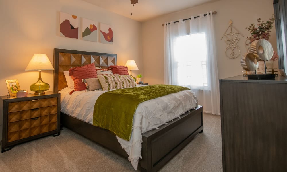Spacious bedroom with ceiling fan at Redbud Ranch Apartments in Broken Arrow, Oklahoma