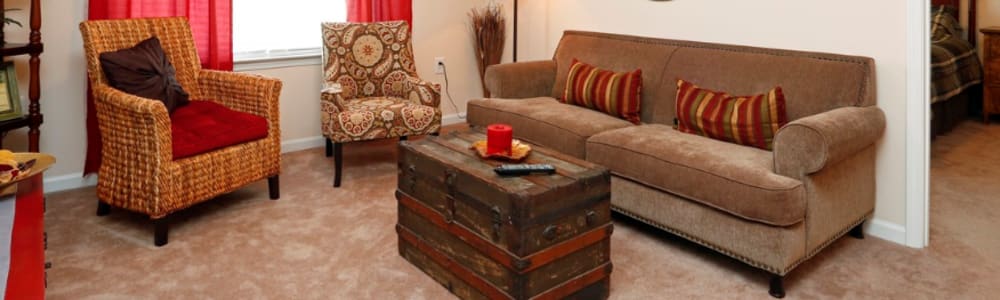 A spacious living room with sophisticated furniture at Compass Landing in Newport, North Carolina