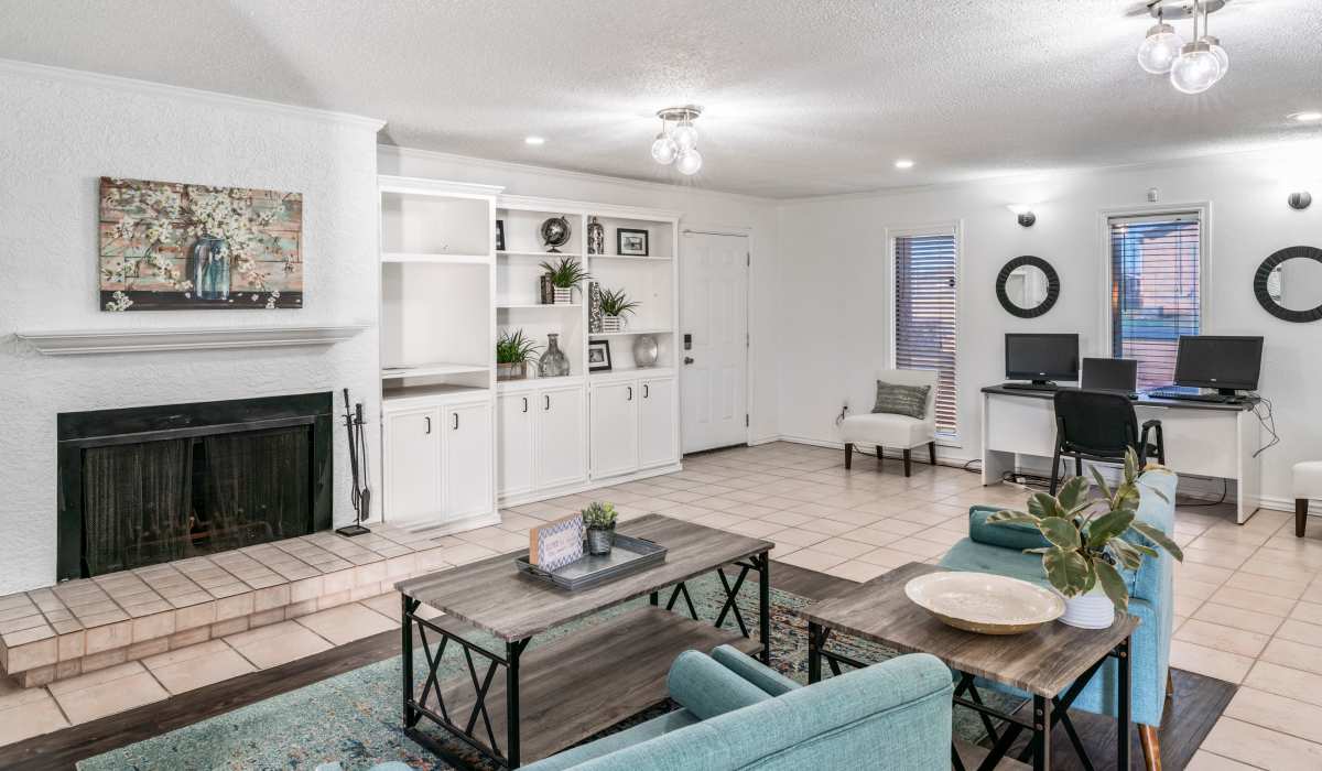 Community clubhouse with fireplace and computers at Riatta Ranch Apartments in Abilene, Texas
