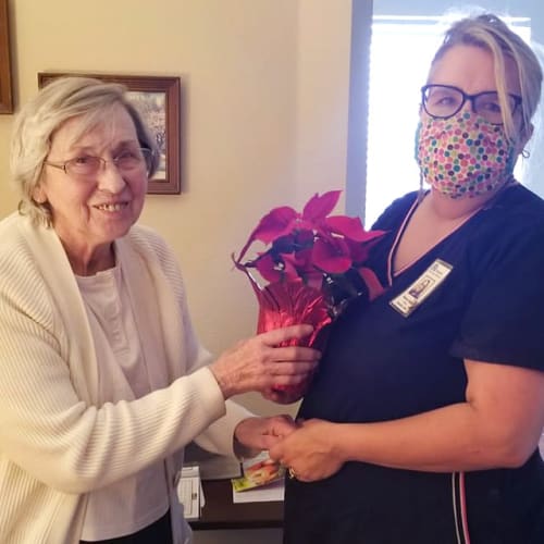 A resident receiving flowers at Creekside Village in Ponca City, Oklahoma